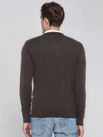 Man in 98degreenorth Men’s Charcoal Merino Wool V-Neck Sweater, back to camera, with light blue jeans.