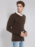 Man models the 98degreenorth Men’s Coffee Merino Wool V-Neck Sweater, a warm neutral knit for business and travel.