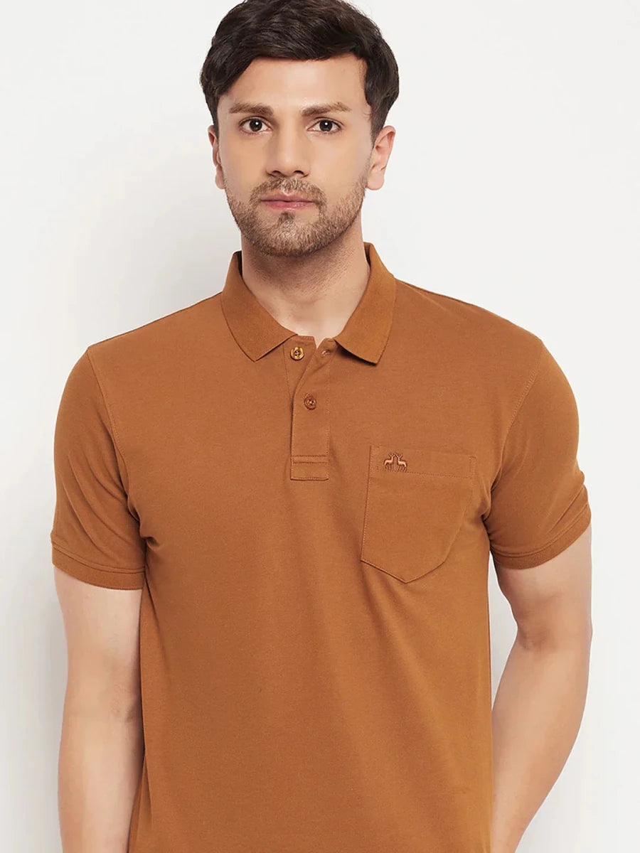 Man in 98degreenorth Men's Copper Polo T-Shirt—Pure Cotton Pique with chest pocket, against white background.