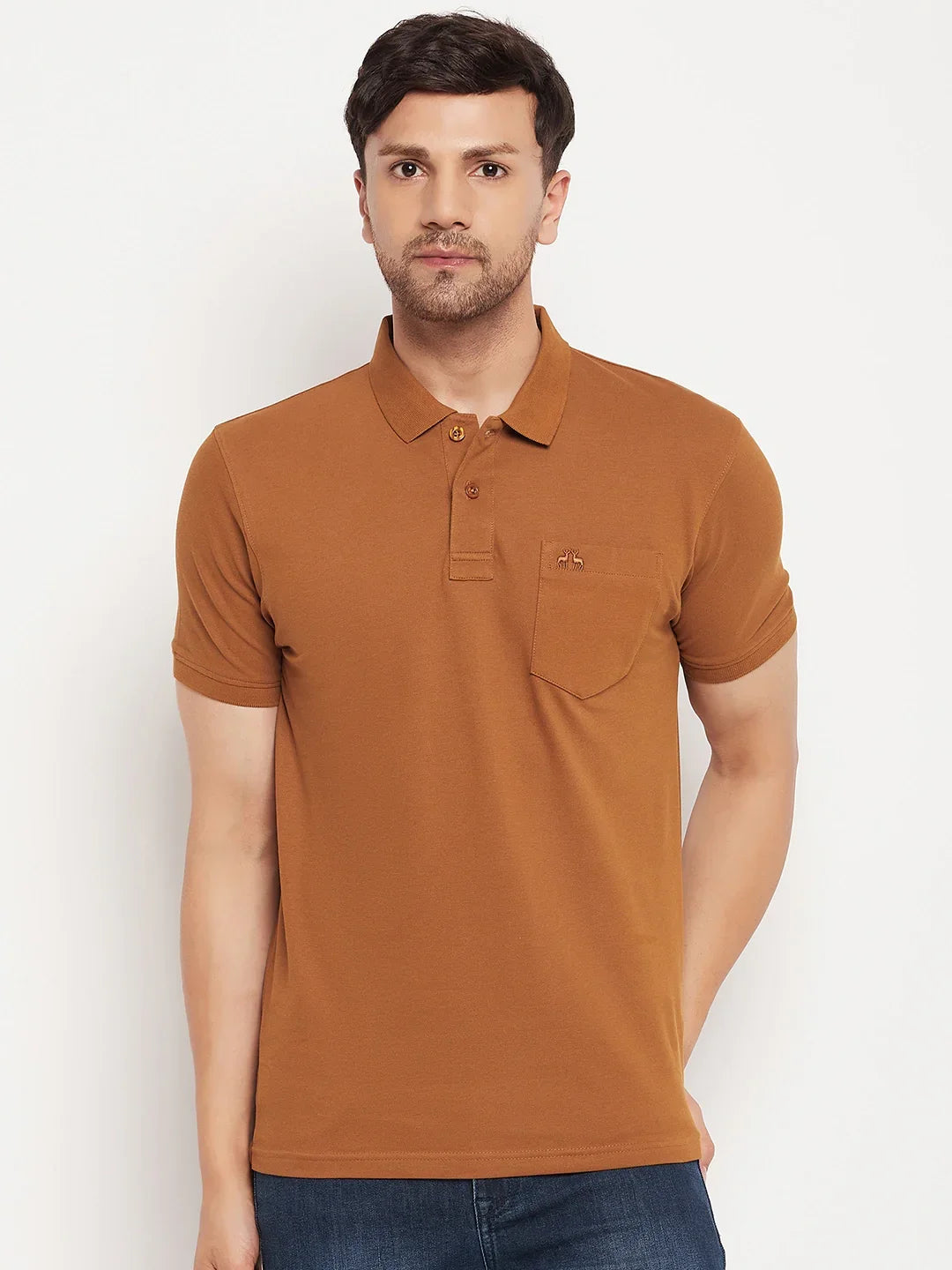 Man wears 98degreenorth Men's Copper Polo T-Shirt—pure cotton pique, chest pocket—against white background.