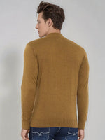 Man in a 98degreenorth Dark Khaki Merino Wool Turtle Neck Sweater and blue jeans, back to camera, plain background.