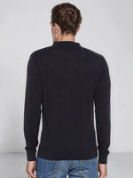 A man wears a 98degreenorth Men’s Dark Navy Merino Wool Polo Sweater, standing with his back to the camera.
