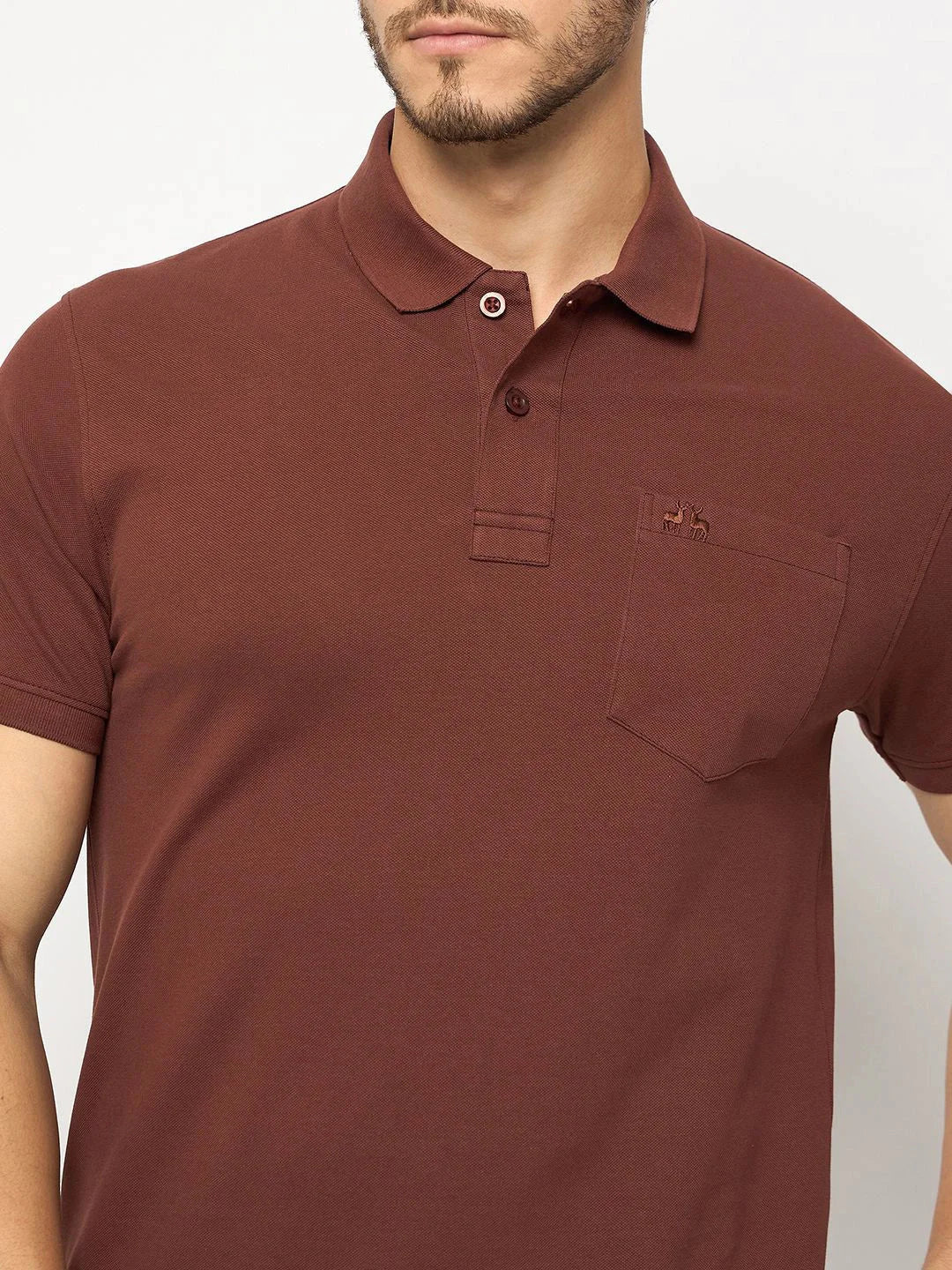 98degreenorth Men's Dark Rust Polo—stretch cotton pique, chest pocket, small logo.