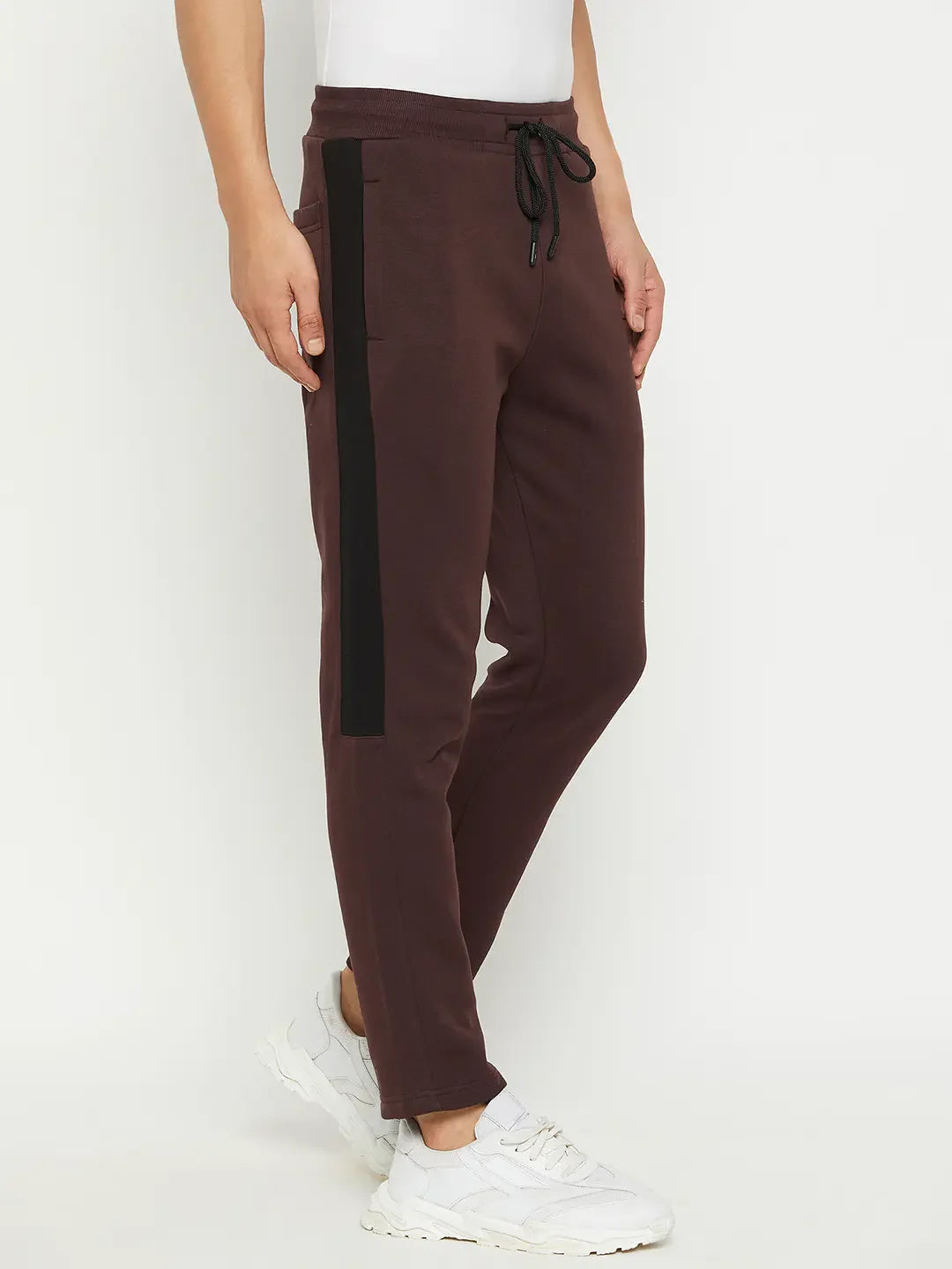 Person wears 98degreenorth Men’s Dark Wine Fleece Trackpants with Side Panel, white tee & sneakers, on white background.