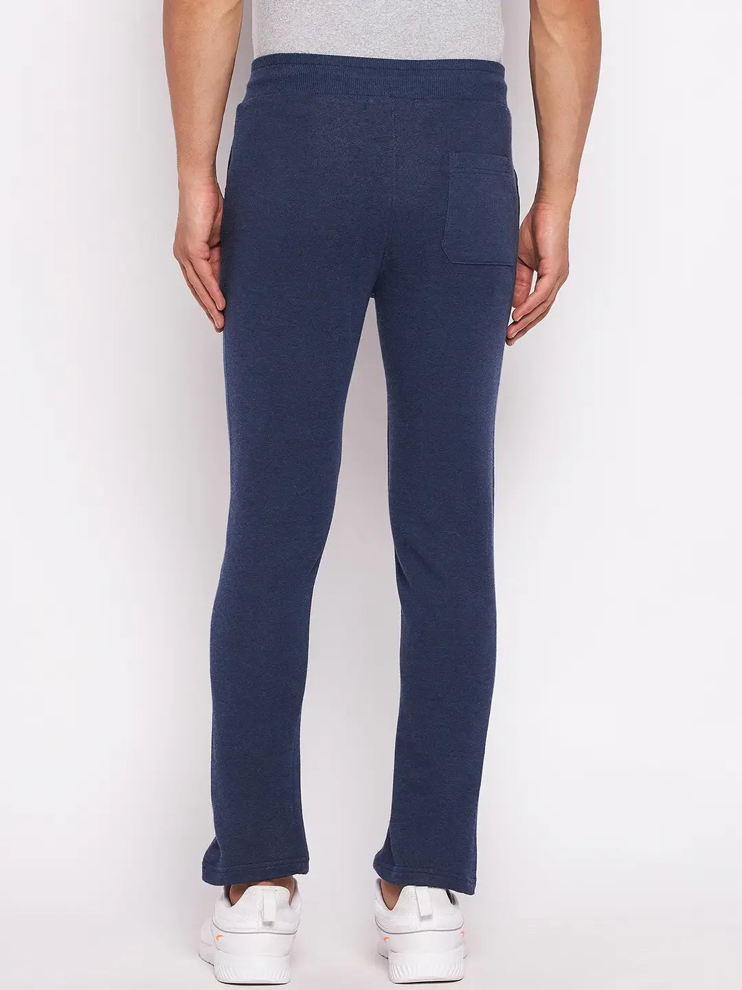 98degreenorth Men’s Denim Fleece Trackpants—trendy knit joggers for travel & fitness, shown from the back on white.