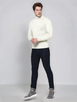 A man in a 98degreenorth Men’s Ecru Merino Wool Turtle Neck Sweater & jeans, smart casual India.