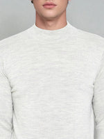 Man in a 98degreenorth Men’s Ecru Merino Wool Turtle Neck Sweater, shown from shoulders to lips.