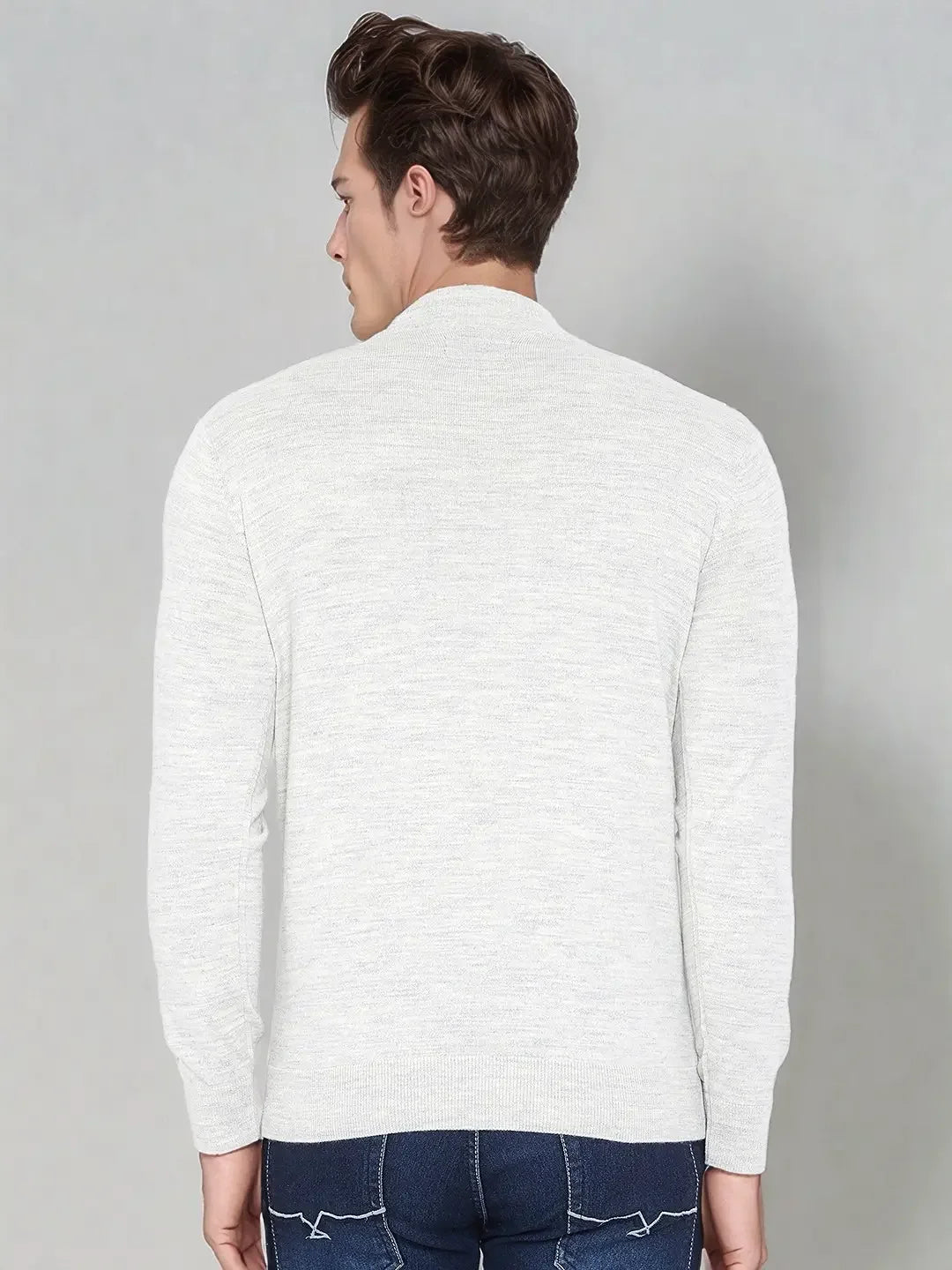 Man with short brown hair wears a 98degreenorth Men’s Ecru Merino Wool Turtle Neck Sweater, facing away.