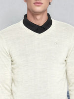 Man in 98degreenorth Men’s Ecru Merino Wool V-Neck Sweater over black shirt, shown shoulders to mouth.