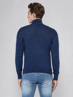 Man in 98degreenorth Men’s Light Denim Merino Wool Turtle Neck Sweater, back to camera.