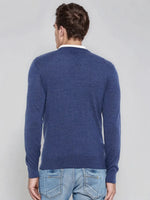 Man in a 98degreenorth Light Denim Merino Wool V-Neck Sweater, back to camera, on a plain background.