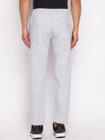 A person wears 98degreenorth Men’s Light Grey Fleece Trackpants with black sneakers, shown from the back.