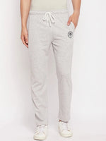Model in 98degreenorth Men's Light Grey French Terry Lycra Trackpants, styled with white sneakers on a plain background.