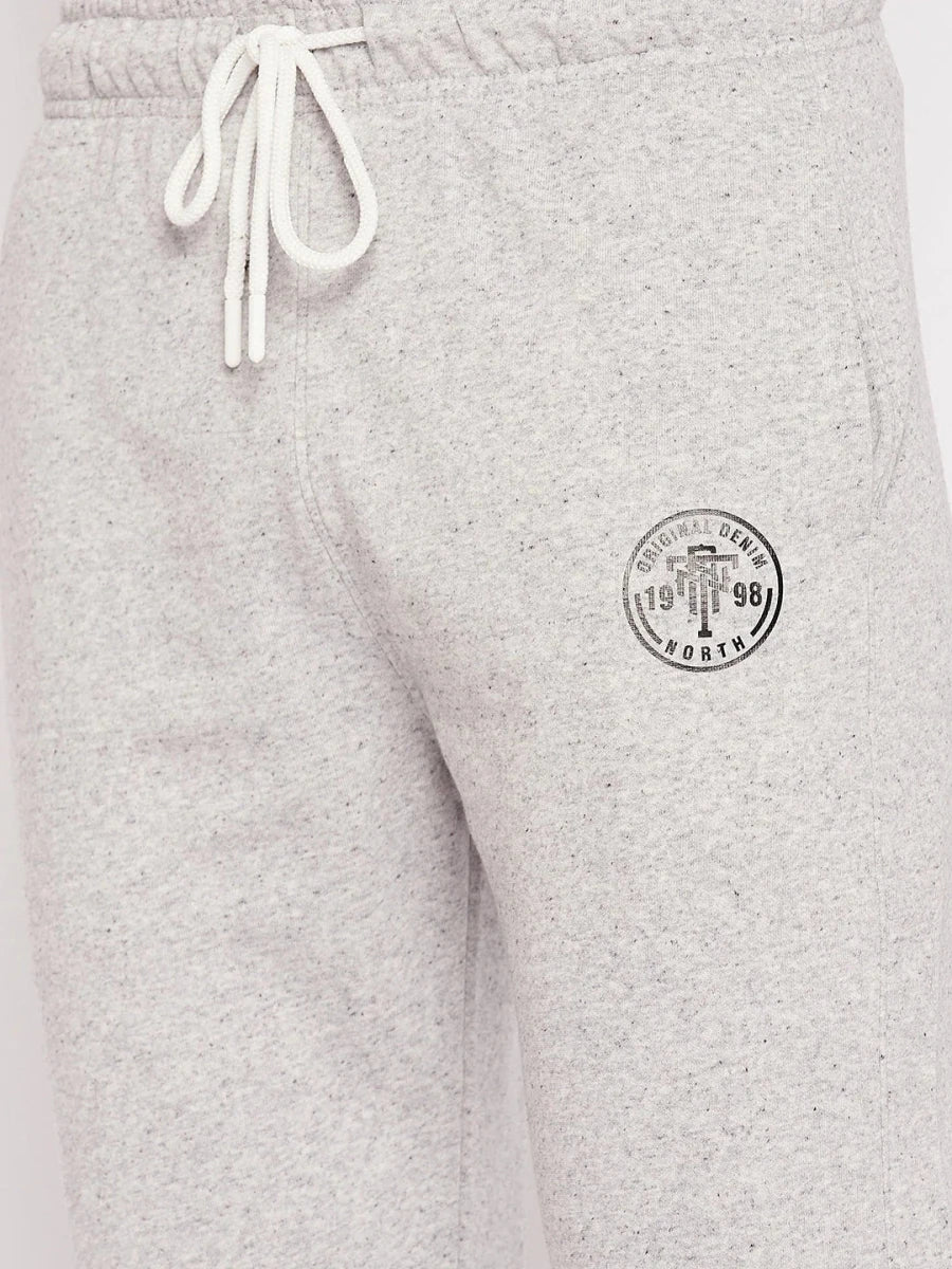 98degreenorth Men's Light Grey French Terry Lycra Trackpants with white drawstrings and logo patch for summer comfort.
