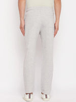 Back view of a man in 98degreenorth Light Grey French Terry Lycra Trackpants, standing against a white background.