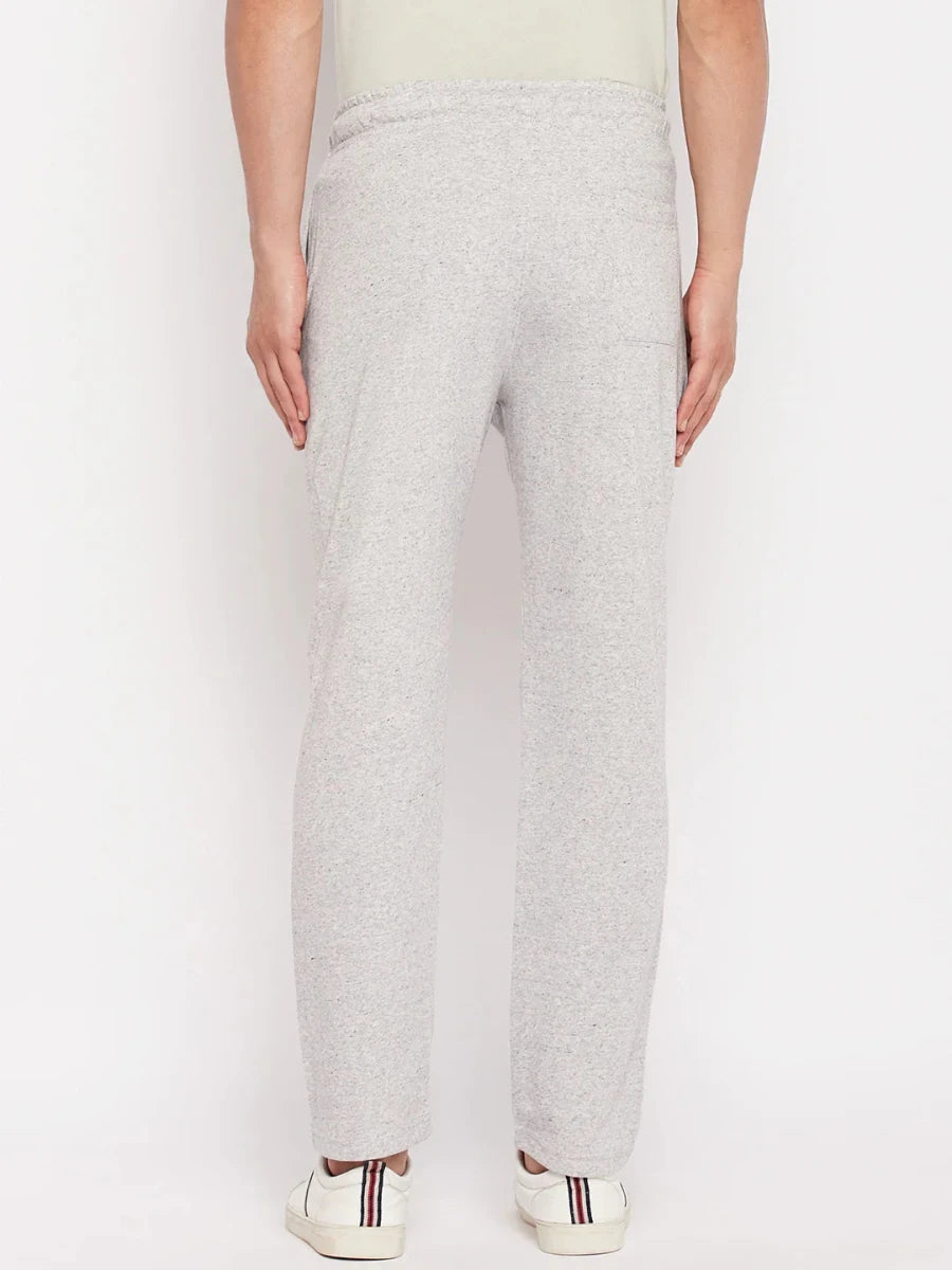 Back view of a man in 98degreenorth Light Grey French Terry Lycra Trackpants, standing against a white background.