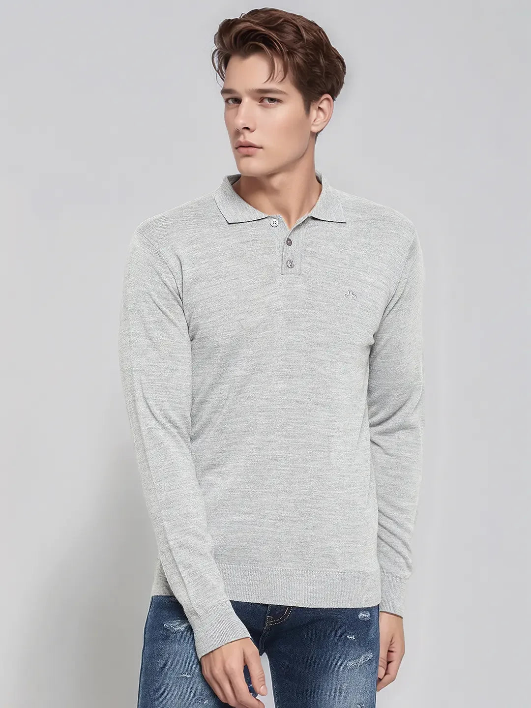Man in 98degreenorth Men’s Light Grey Merino Wool Polo Sweater, styled with blue jeans, against a light background.