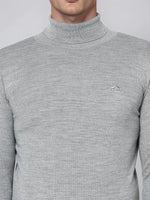 Man in 98degreenorth Light Grey Merino Wool Turtle Neck Sweater—refined winter knitwear for work or travel.