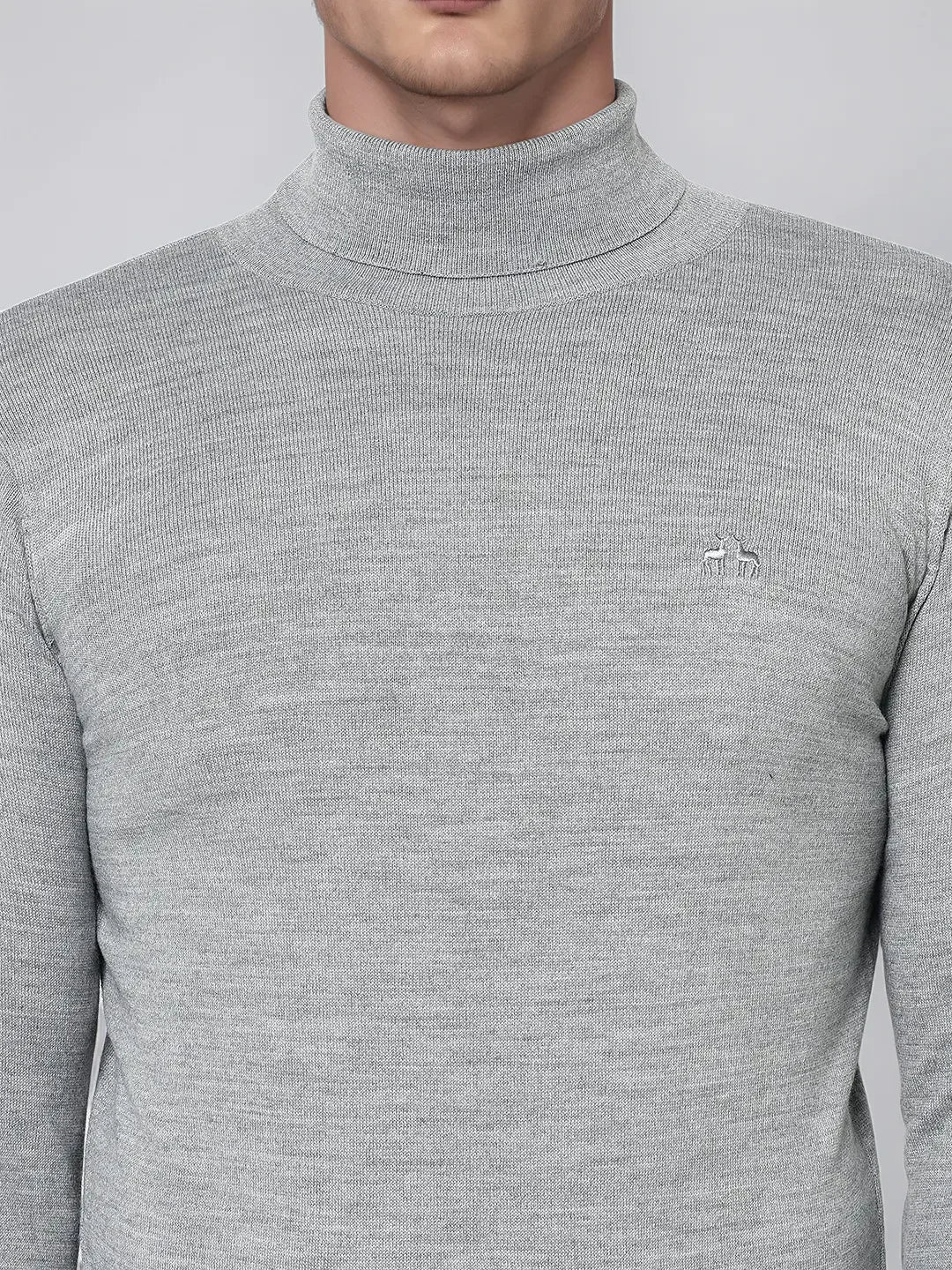 Man in 98degreenorth Light Grey Merino Wool Turtle Neck Sweater—refined winter knitwear for work or travel.
