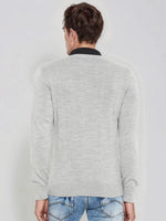 Man in 98degreenorth Men’s Light Grey Merino Wool V-Neck Sweater and blue jeans, seen from behind.