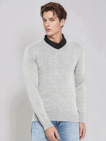 Young man in a 98degreenorth light grey Merino wool V-neck sweater for work, over a black shirt and jeans.