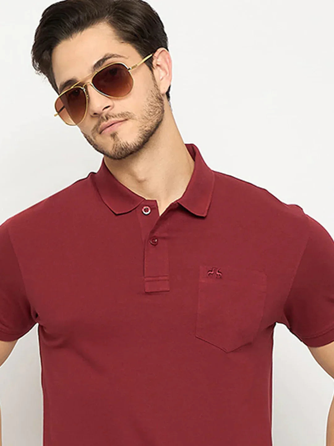 Man in 98degreenorth Men's Maroon Polo T-Shirt—Stretch Cotton Pique with Chest Pocket, against a light background.