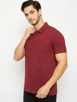 Man wears 98degreenorth Men's Maroon Polo T-Shirt, stretch cotton pique with chest pocket, against white background.