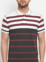 Man wears 98degreenorth Men's Mauve Olive Striped Polo T-Shirt in soft pique knit with bold maroon, white, black stripes.