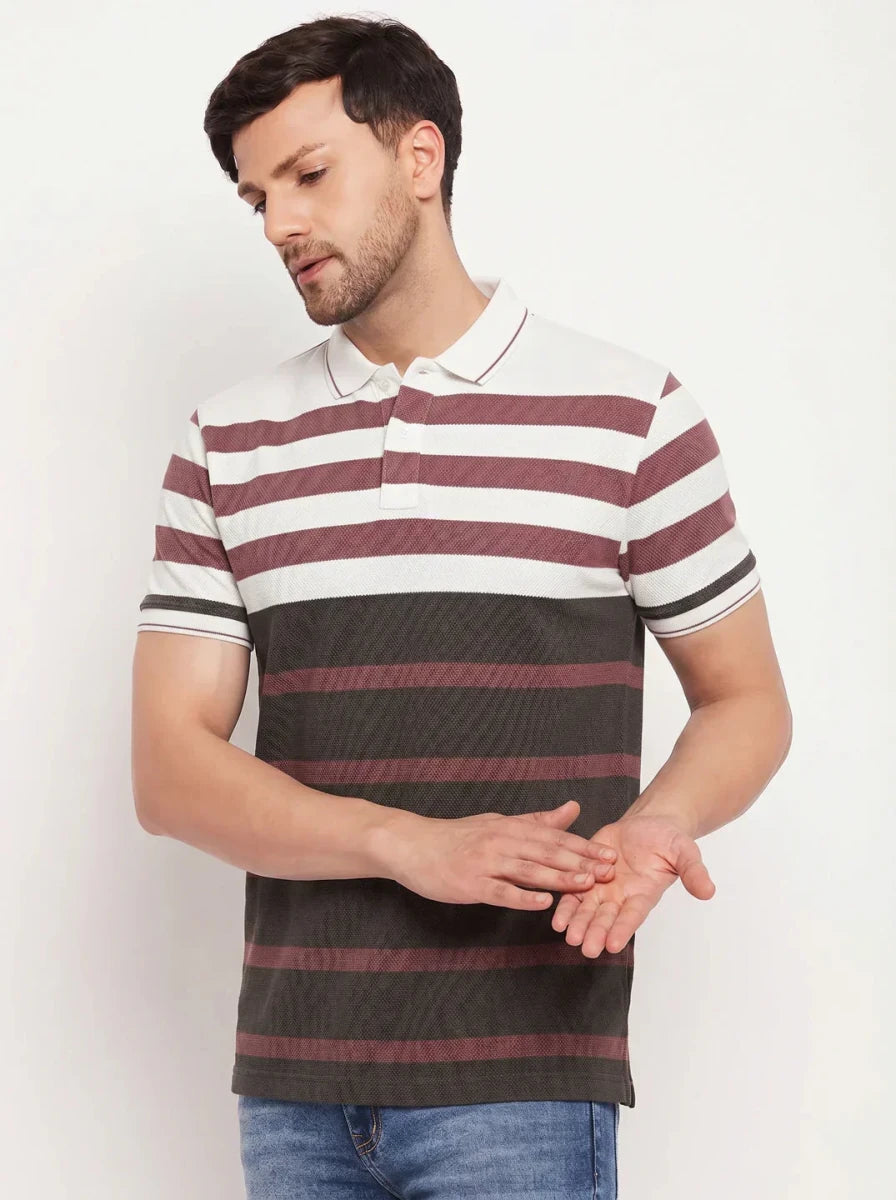 Man wears 98degreenorth Men's Mauve Olive Striped Pique Polo T-Shirt, standing with hands apart against white background.