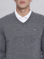 Man in 98degreenorth Men’s Medium Grey Merino Wool V-Neck—a classic corporate pullover for everyday office wear.