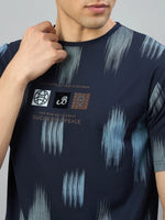 Man wearing a 98degreenorth Men's Navy Abstract Ikat Print T-Shirt in Cotton Lycra.