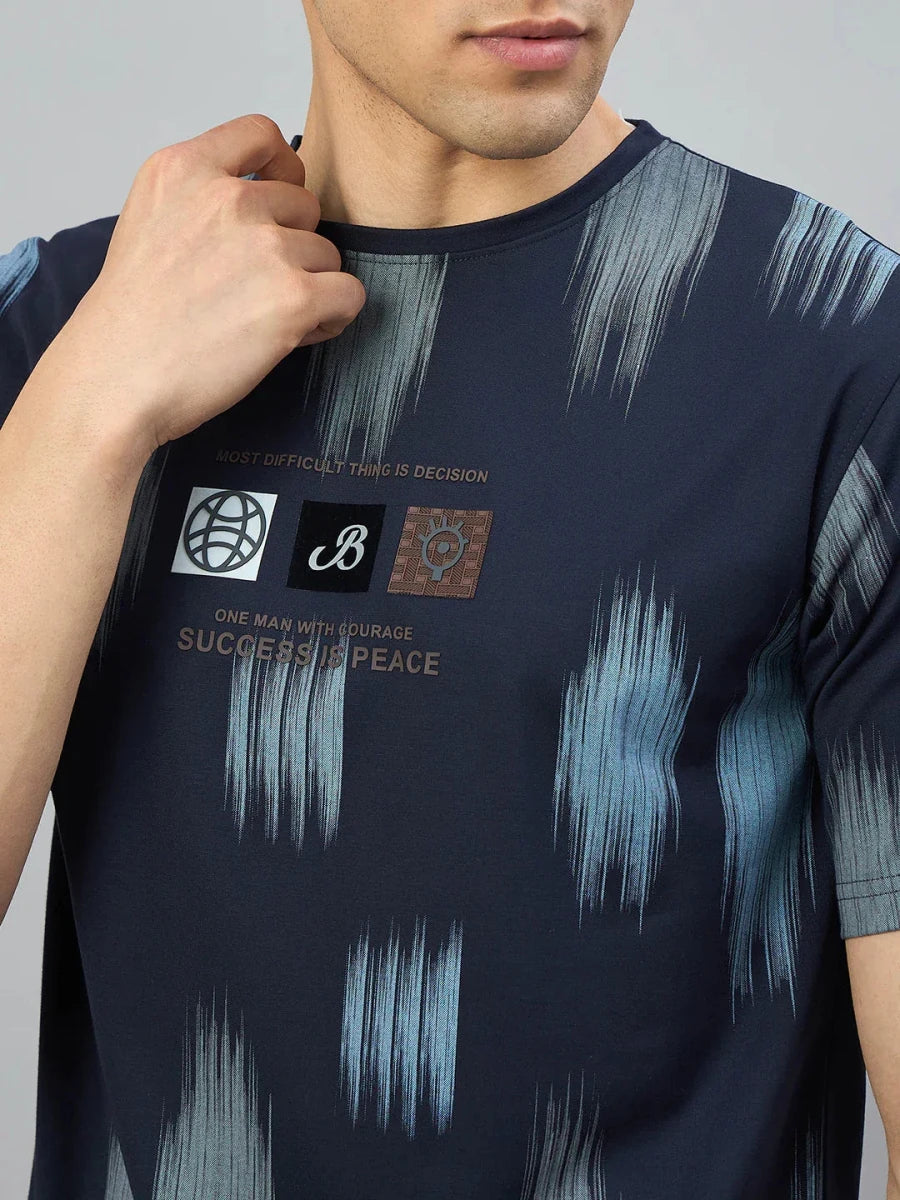 Man wearing a 98degreenorth Men's Navy Abstract Ikat Print T-Shirt in Cotton Lycra.