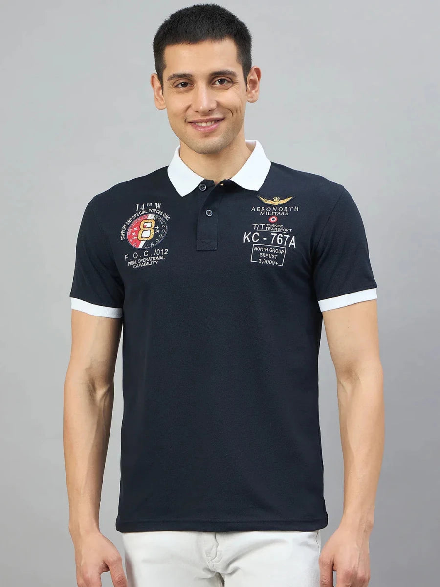 Man wearing a Men's Navy Aeronorth KC-767A Aviation Polo T-Shirt by 98degreenorth, smiling at camera.
