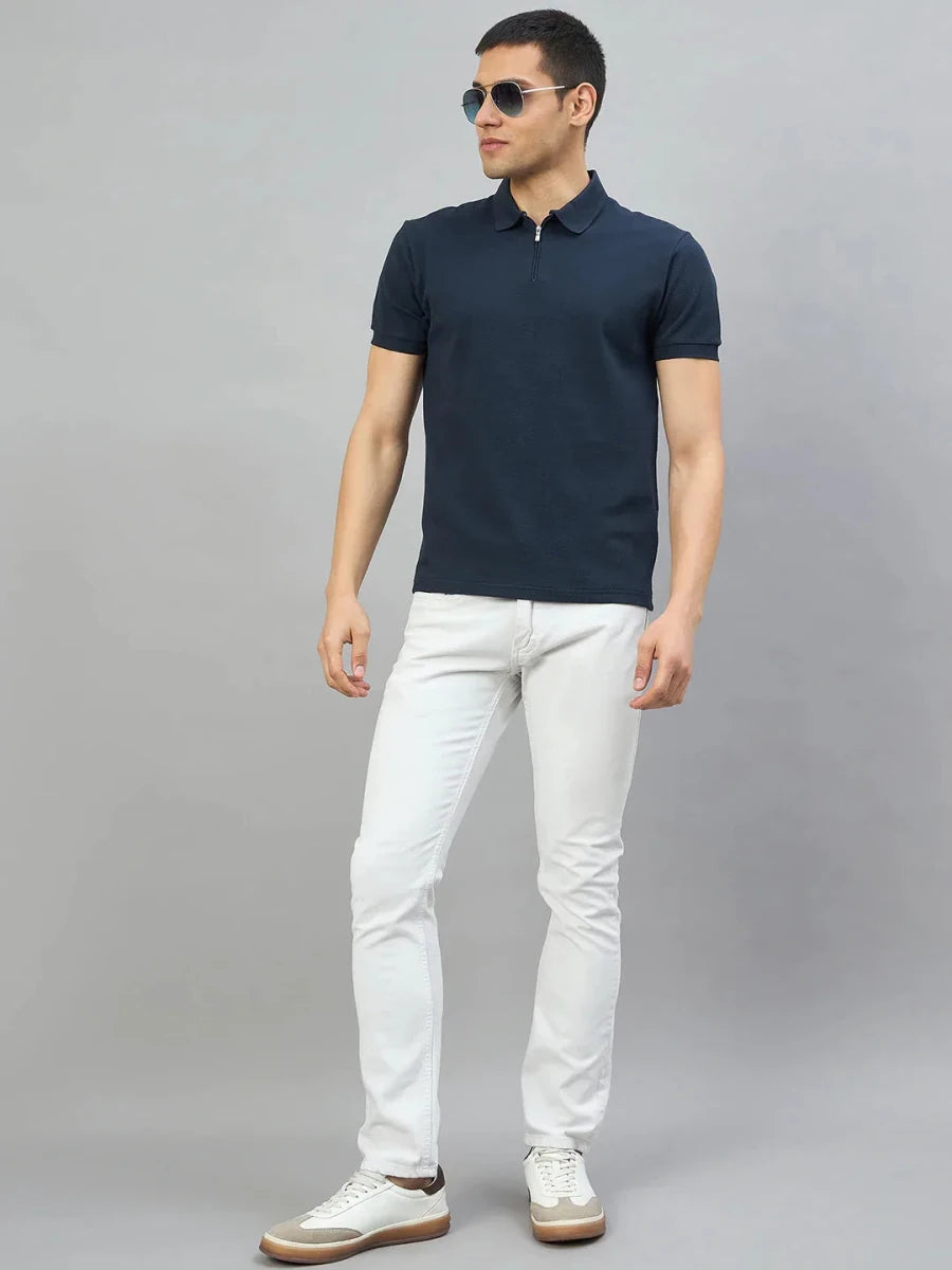 Man wears 98degreenorth Men's Navy Blue Quarter Zip Polo T-Shirt—Popcorn Knit against a plain gray background.