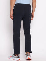 Man in 98degreenorth Men's Navy Fleece Trackpants—classic warm joggers for gym, travel, and winter athleisure style.