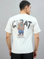 A man wears a 98degreenorth Men's Off-White Graphic Oversized T-Shirt with GOAT back print against a plain background.