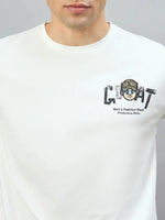 A man wearing a 98degreenorth Off-White Graphic Oversized T-Shirt with GOAT back print.