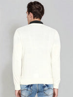 A man wears the 98degreenorth Men’s Off-White Merino Wool V-Neck Sweater, seen from the back against a gray backdrop.
