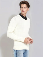 A young man wears the 98degreenorth Men’s Off-White Merino Wool V-Neck Sweater against a plain light gray background.