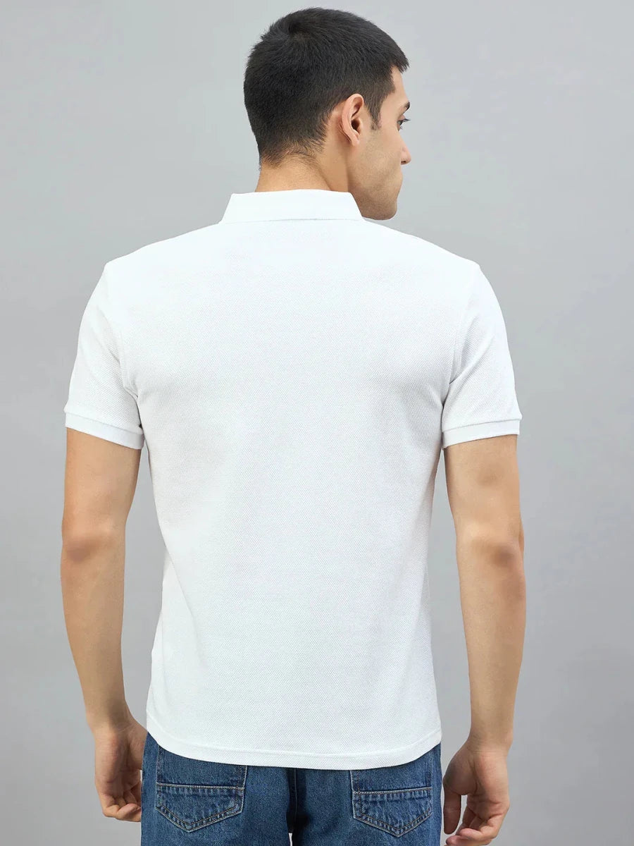A man in a 98degreenorth Off-White Popcorn Knit Quarter Zip Polo faces away in front of a gray background.