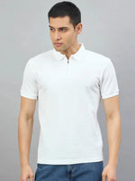 Man wears 98degreenorth Men's Off-White Quarter Zip Polo T-Shirt—Popcorn Knit—against a plain gray background.