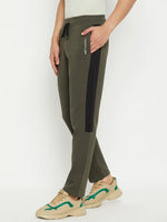 Person wearing 98degreenorth Men’s Olive Fleece Trackpants with Side Panel and beige sneakers, against a plain background.