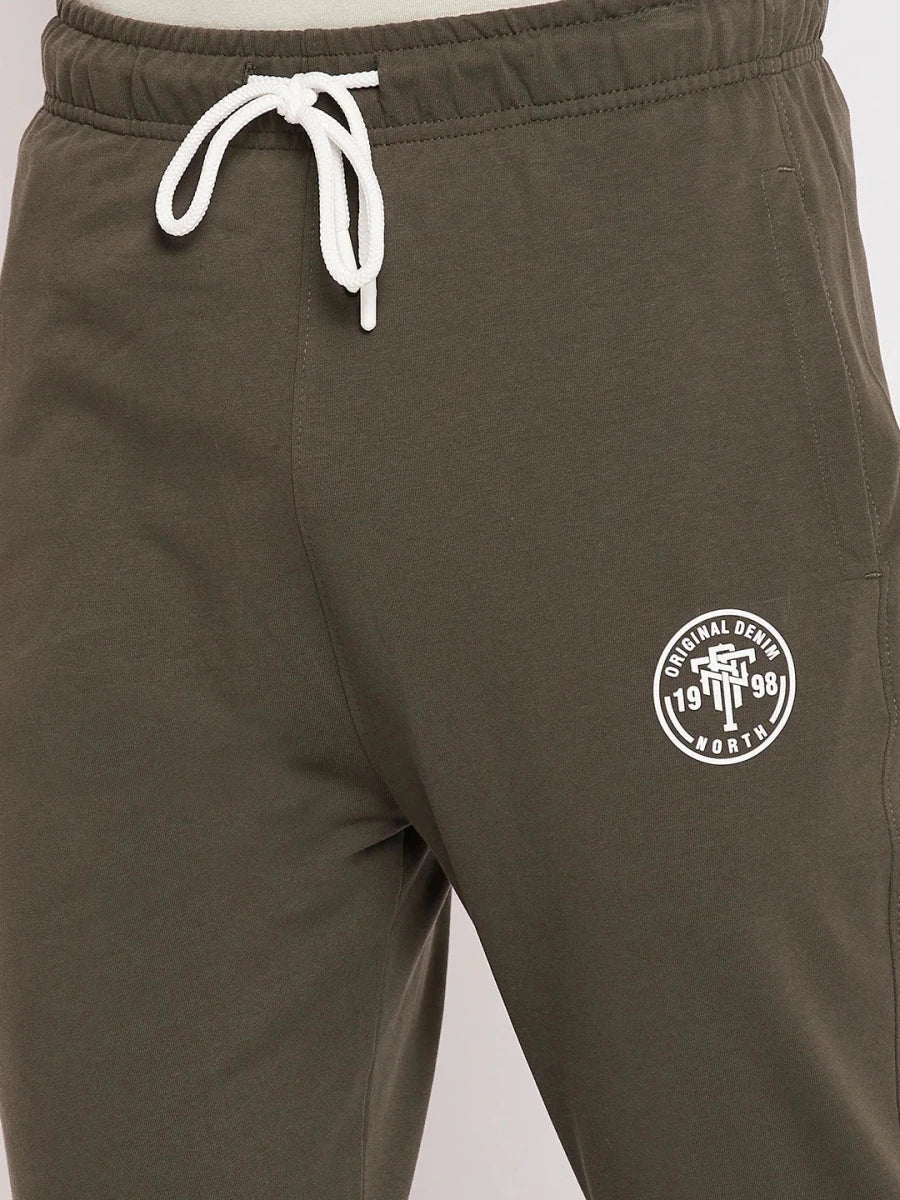 98degreenorth Men's Olive French Terry Lycra Trackpants with white drawstring and circular logo, ideal for summer.