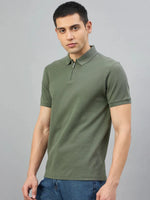 Man wears 98° North Olive Green Quarter Zip Polo T-Shirt, Popcorn Knit, standing against a plain grey background.