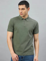 Man in 98degreenorth Olive Green Quarter Zip Polo T-Shirt — Popcorn Knit, posed against a gray background.