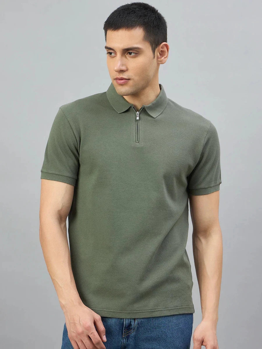 Man in 98degreenorth Olive Green Quarter Zip Polo T-Shirt — Popcorn Knit, posed against a gray background.
