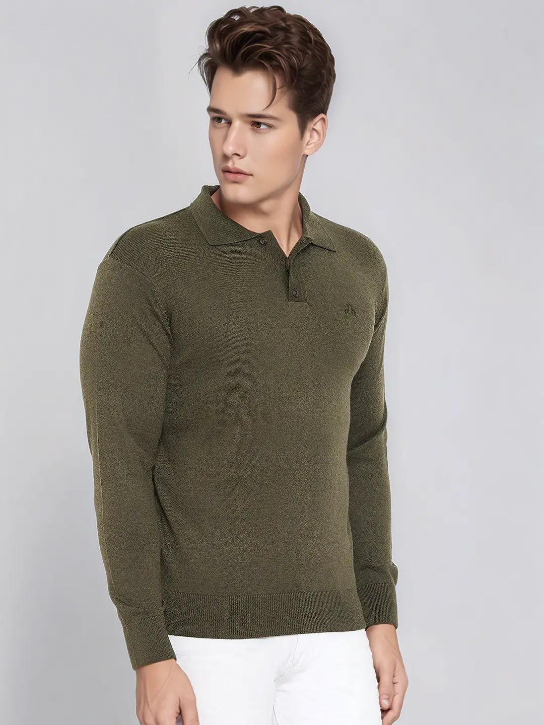Man wearing 98degreenorth Men’s Olive Merino Wool Polo Neck Sweater and white pants, on a light gray background.