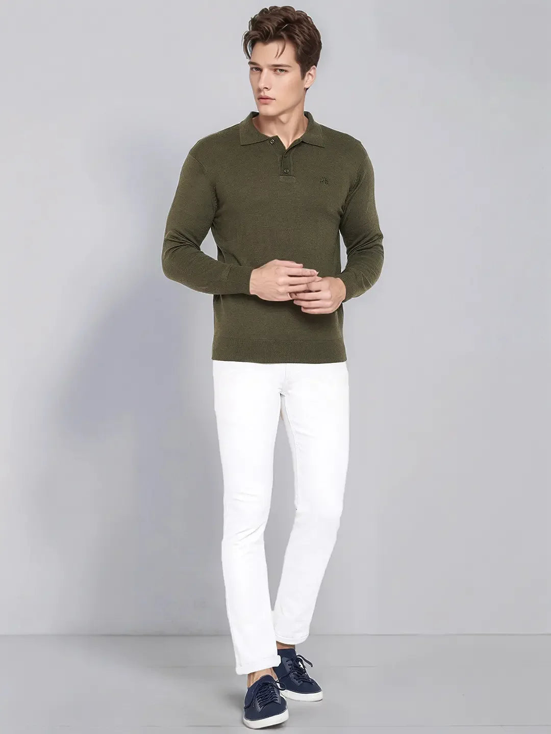 A man in a 98degreenorth Men’s Olive Merino Wool Polo Neck Sweater stands against a light gray background.