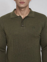 Man wears 98degreenorth Olive Merino Wool Polo Neck Sweater, knit pullover with small chest logo.
