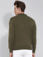 Man in a 98degreenorth Men’s Olive Merino Wool Polo Neck Sweater, elegant pullover, paired with white pants, facing away.